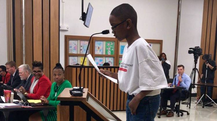 A child stands on a box as he testifies in support of the Ignite Achievement Academy during a meeting of the Indianapolis Public Schools Board on Thursday, March 16, 2017. - IPS Public Schools