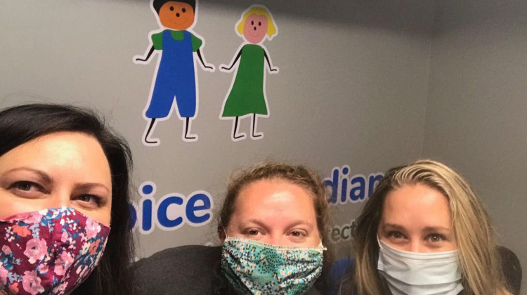 Employees at Kids' Voice of Indiana model face masks made by volunteers at the Indiana Region of the American Red Cross. - CREDIT KIDS' VOICE OF INDIANA