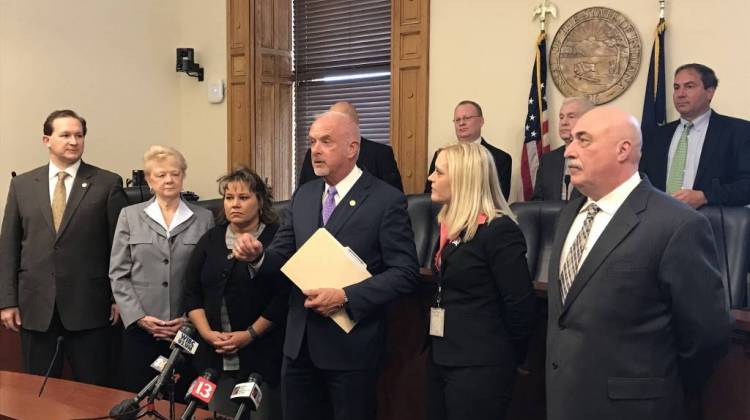 Baby box supporters, led by Sen. Travis Holdman (R-Markle), center, discuss the baby box expansion bill at the start of the 2018 session.  - Brandon Smith/IPB News