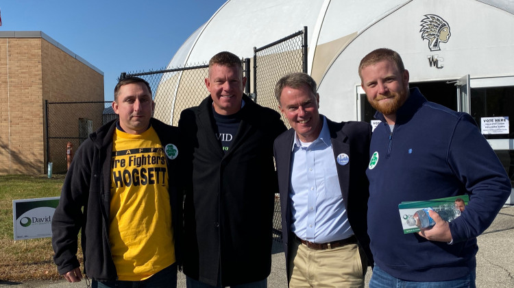 Democratic Incumbent Mayor Joe Hogsett poses with voters outside Warren Central High School Tuesday.