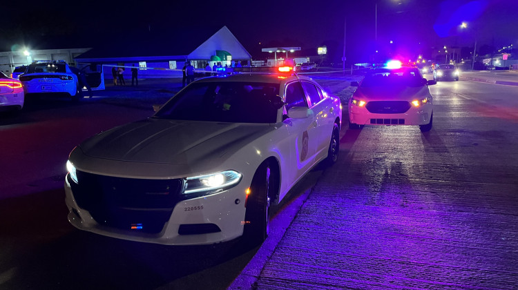 IMPD vehicles outside of Greene’s Auto and Truck Service late Friday. - Ben Thorp/WFYI News