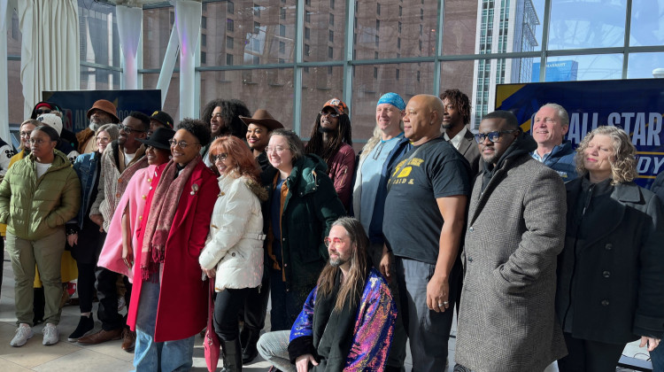 Local artists gather for a picture after the NBA All-Star arts announcement. - Jill Sheridan/WFYI