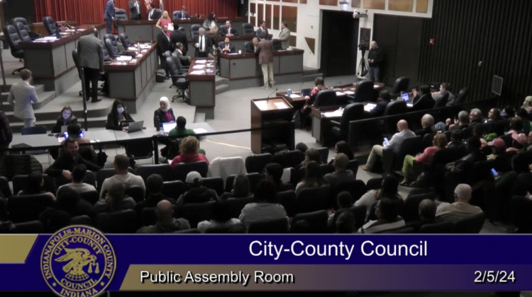 A stream from the City-County Council meeting shows a packed house.