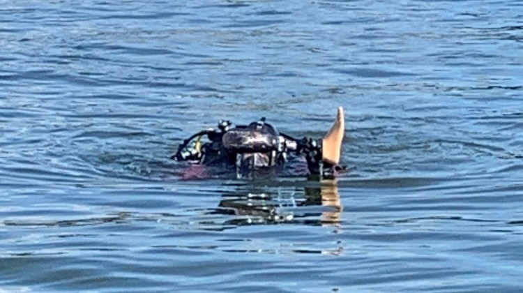 An Indianapolis Fire Department diver surfaces after retrieving a prosthetic leg that had been lost in Geist Reservoir. A woman lost the leg while spending the day on her family's anchored pontoon boat. - Provided by the Indianapolis Fire Department