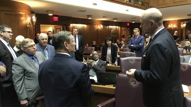 Speaker Brian Bosma (R-Indianapolis), right, tries to negotiate with Democrats on the House floor as the session's clock ran out.  - Brandon Smith/IPB News