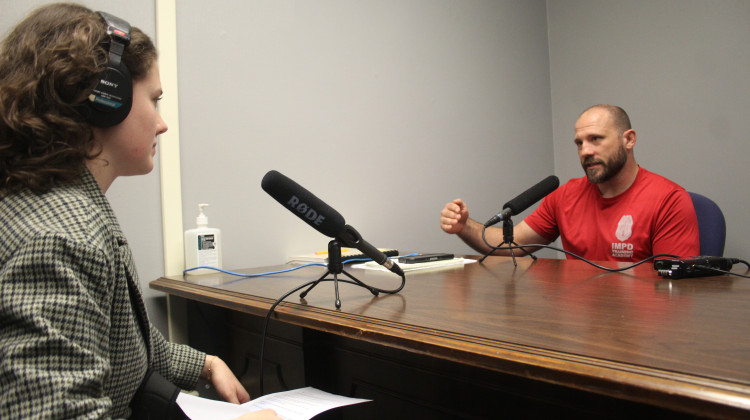 WFYI criminal justice reporter interviews IMPD Officer Damon Young on Dec. 11, 2023. - Ben Thorp/WFYI News
