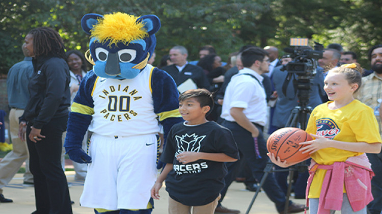 Children from the Shepherd Community Center in Indianapolis play basketball with Indiana Pacers mascot Boomer. - Erica Irish/WFYI