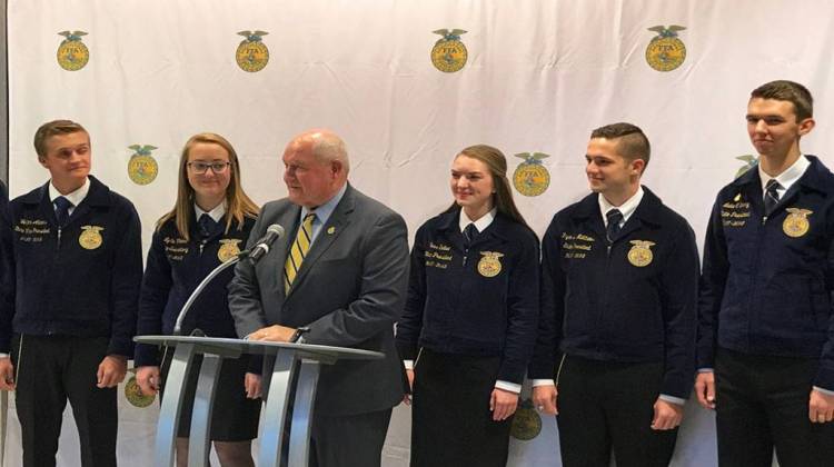 USDA Secretary Sonny Perdue addresses reporters Wednesday flanked by FFA members. - Nick Janzen/IPB News