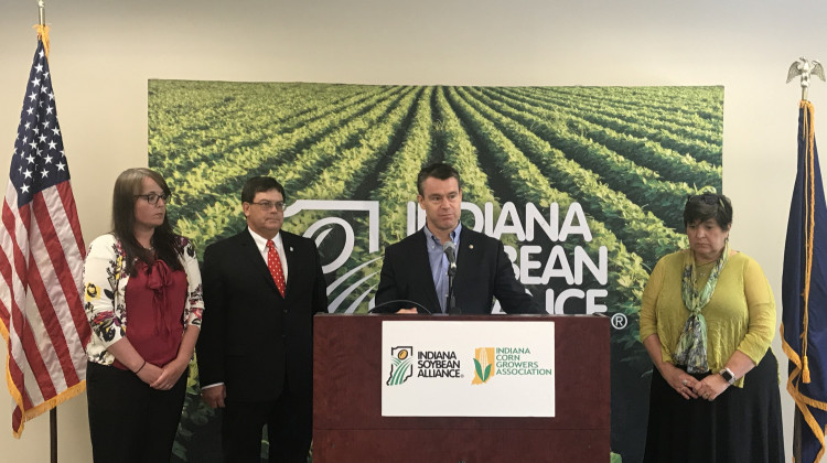 From left to right: Sarah Delbecq, president of the Indiana Corn Growers Association; Phil Ramsey, chairman of the Soybean Membership and Policy Committee; Sen. Todd Young; and Jane Ade Stevens, CEO of the Indiana Corn Marketing Council. - Emily Cox/WFYI