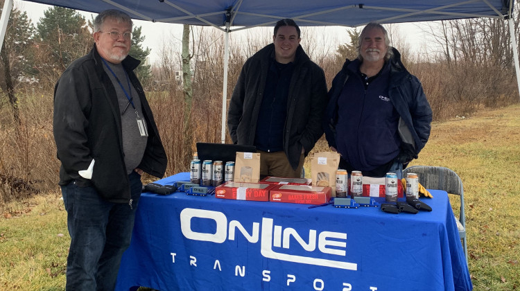 Celadon employee Mike Duckett visits with representatives offering help outside Celadon headquarters.  - Jill Sheridan/WFYI