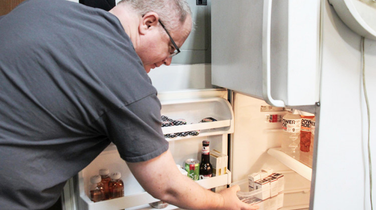 Craig Miller, who has Type 1 diabetes, stores insulin in a refrigerator in his garage. - Farah Yousry/Side Effects Public Media