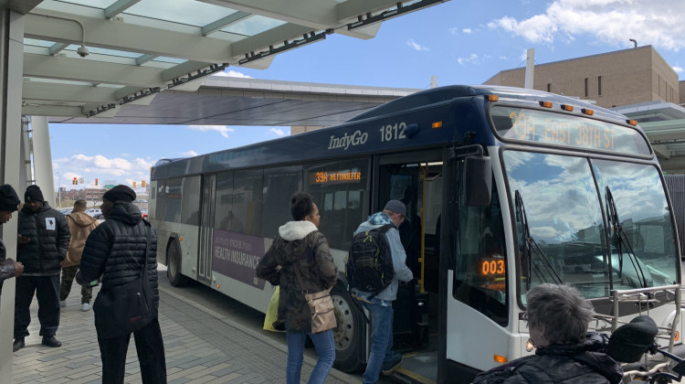 Passengers board an IndyGo bus. - Jill Sheridan WFYI