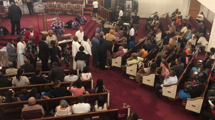 Nearly 300 people gathered for a vigil at Mount Olive Baptist Church Monday night to remember nine members of an Indianapolis family killed in the Missouri duck boat accident. - Cora Butrum/WFYI