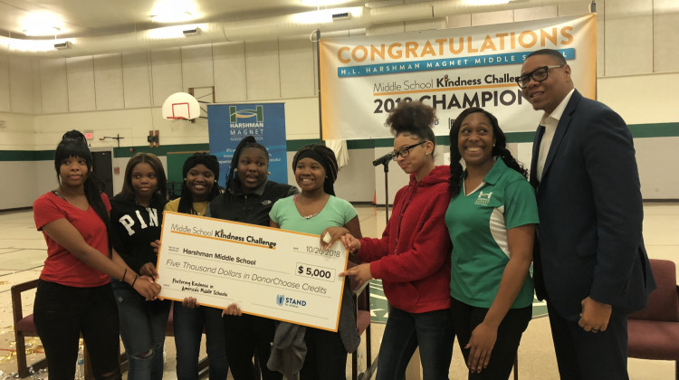 The students who organised the Kindness Challenge, along with their advisor Shari' Thomas were presented a $5,000 check to continue promoting kindness at Harshman. - Carter Barrett/WFYI