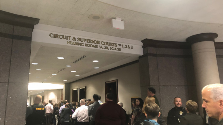 A line of people gathers outside the Hamilton County courtroom for the hearing of the suspect accused of shooting his teacher and classmate at Noblesville West Middle School. - Carter Barrett/WFYI