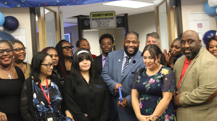 Members of the IndyPendence Jobs Corps cut the ribbon on a new, larger location - Ben Thorp/WFYI