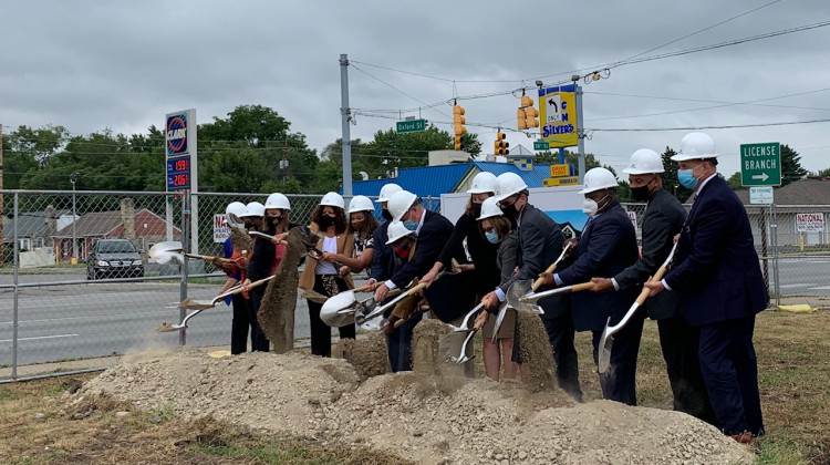 Representatives of First Merchants Banks and Indianapolis officials break ground for a new bank branch on the city's near northeast side. - Jill Sheridan/WFYI