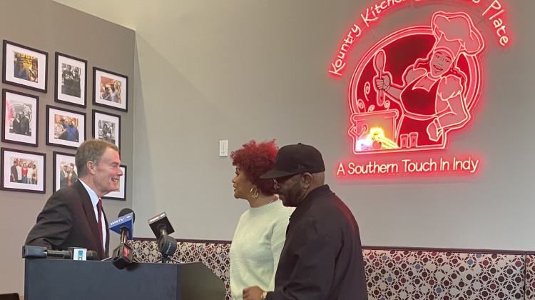 Mayor Joe Hogsett (left) stands with Kountry Kitchen owners Cynthia Wilson (middle) and Isaac Wilson (right). Kountry Kitchen reopened after a fire destroyed the building in 2020. - (WFYI News/Abriana Herron)