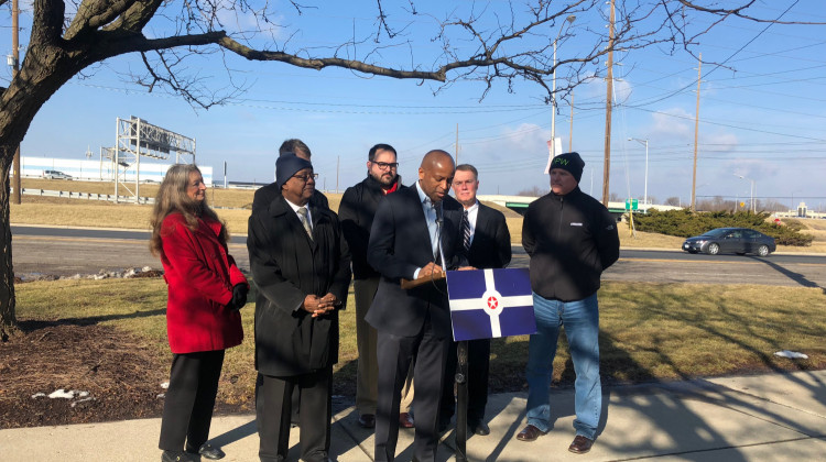 City-County Council President Vop Osoli and Indianapolis Mayor Joe Hogsett applauded adding funding to the 2019 budget to address roadwork concerns.  - Carter Barrett/WFYI