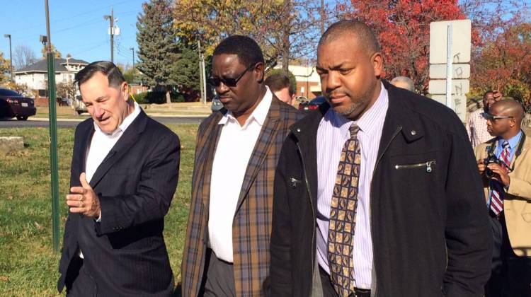 Sen. Joe Donnelly (L) meets with Tyrone Chandler (C) and other community leaders during his visit to the northwest side of Indianapolis. - Photo By: Deron Molen