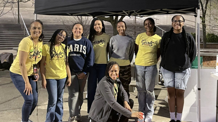 The Girls STEM Institute research team captures images of the 2024 eclipse for NASA. Left to right: Renee Barlow, Priya J., Nadia S., Asha S., Brooke T., Elizabeth Y. and Shae’la C. Front row, center: Dr. Crystal Morton. - Camike Jones / Indianapolis Recorder