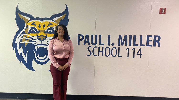Daria Parham, the principal of Paul I. Miller School 114, stands in front of a school sign on Tuesday, Nov. 1, 2022. The Indianapolis Public Schools administration has proposed a plan that includes closing the building that house School 14 and merging the academic program into another school.  - Elizabeth Gabriel/WFYI News