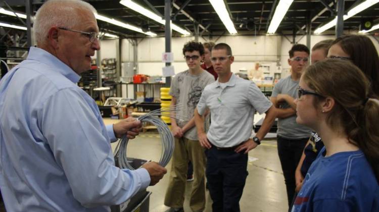 Students from Carroll Junior-Senior High School get a tour of Kirby Risk in Lafayette. Their industrial technology teacher is Tyler Sausaman, center. - Annie Ropeik/IPB News