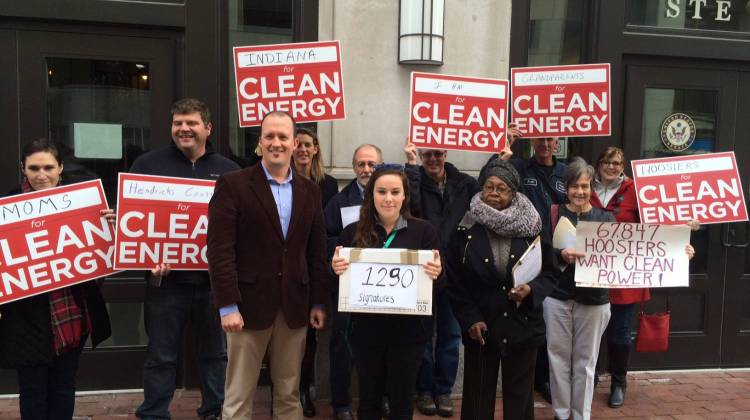 Matthew Myer Boulton (third from L) and other activists gathered outside Sen. Joe Donnelly's office to urge the senator to reject a Congressional Review Act resolution on carbon emissions. - Photo By: Deron Molen