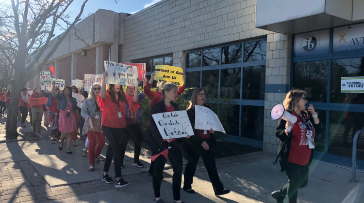 Before the school day, teachers at Westlane Middle School rallied outside of the school to call on lawmakers to increase school funding. - Carter Barrett/WFYI