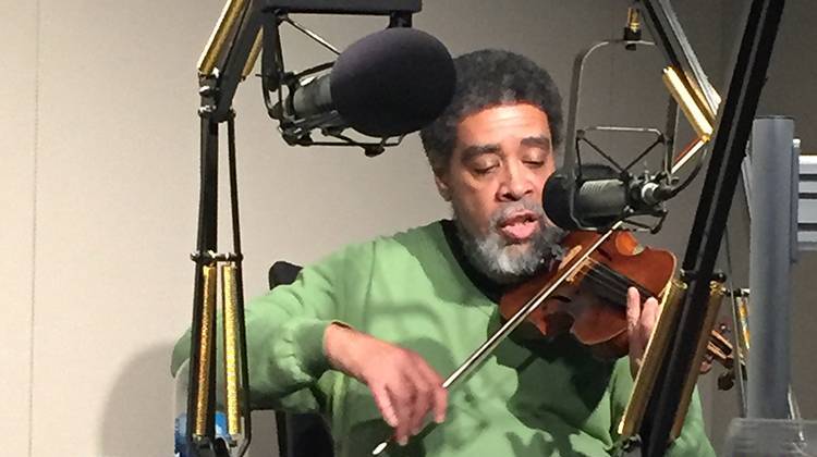 Jesse Hawkins plays his violin in the WFYI studio.