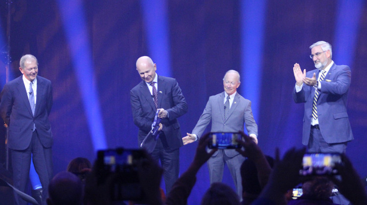 Saab CEO Michael Johansson, Purdue President Mitch Daniels, and Indiana Gov. Eric Holcomb cut the ribbon for the new facility. - Ben Thorp/WBAA