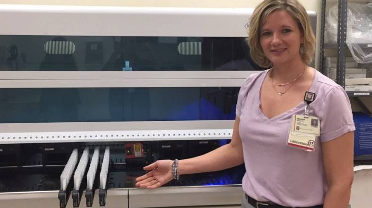 Melissa Randolph, cytopathology supervisor at Indiana University Health, shows a new piece of equipment in the lab. - Jill Sheridan/IPB News