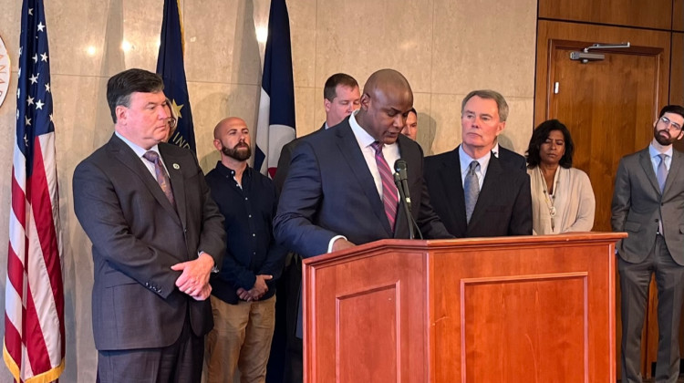 Attorney General Todd Rokita (left) joined other leaders to help renters resolve habitability issues last year. (Jill Sheridan WFYI)