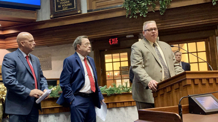 Indiana Fraternal Order of Police President Bill Owensby, right, speaks about proposed legislation alongside Sen. Michael Crider (R-Greenfield), left, and Sen. Mike Young (R-Indianapolis), center. - (Brandon Smith/IPB News)