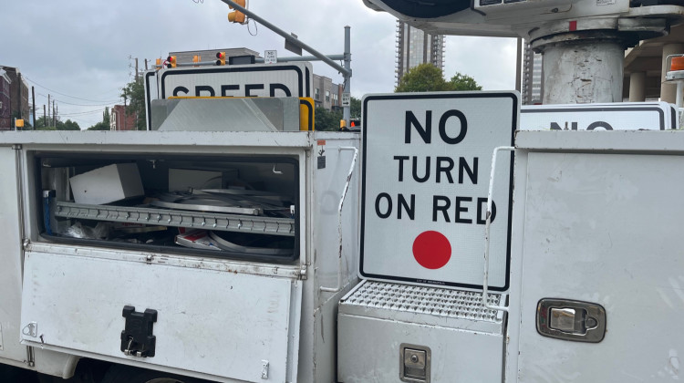DPW crews installing no turn on red signs. - Jill Sheridan/WFYI News