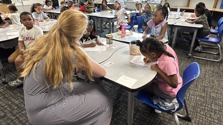 First-graders at Winding Ridge Elementary in the Metropolitan School District of Lawrence Township work on a writing assignment earlier this school year. Lawrence Township is one of eight districts in the county with a starting salary of at least $50,000 for teachers.  - Amelia Pak-Harvey / Chalkbeat