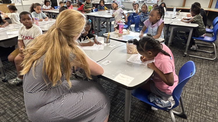 First-graders at Winding Ridge Elementary in the Metropolitan School District of Lawrence Township work on a writing assignment earlier this school year. Lawrence Township is one of eight districts in the county with a starting salary of at least $50,000 for teachers. - Amelia Pak-Harvey / Chalkbeat