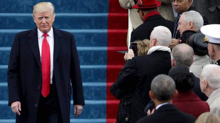 President Trump walks down the steps of the U.S. Capitol on Friday.