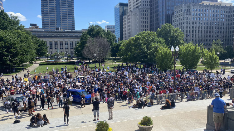 A few hundred protesters gather at the Indiana War Memorial after marching from the Indiana Statehouse. The demonstration is also working to register people to vote. - Darian Benson/Side Effects
