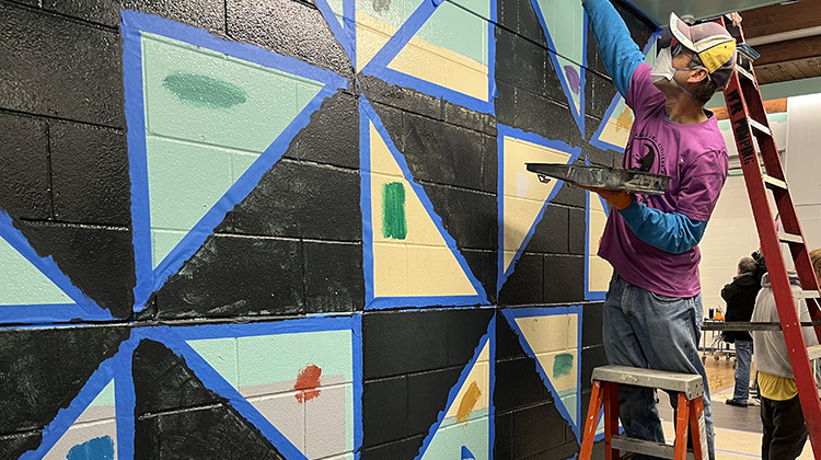 Volunteers fix up the family center at Ellenberger Park. - Jill Sheridan/WFYI News