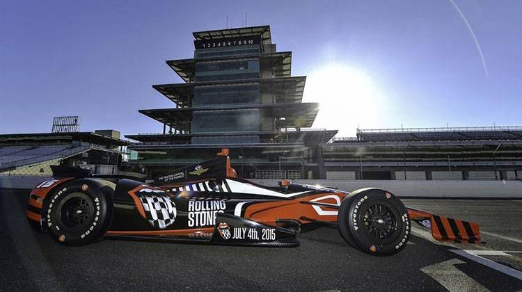 Indianapolis Motor Speedway President Doug Boles announced the Rolling Stones concert Tuesday by unveiling this IndyCar. - Photo by Chris Owens / courtesy IMS
