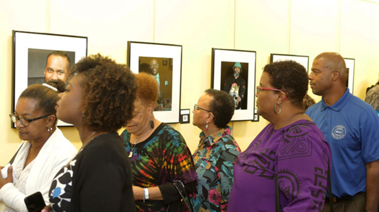 Visitors view “Sons: Seeing the Modern African American Male” at Central library on Sept. 28, 2018. - Photo courtesy Tyrone Thomas