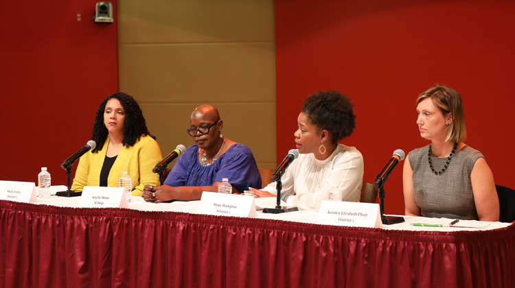 Candidates for the board of Indianapolis Public Schools talk at a public forum on Thursday, Oct. 5, 2022 Central Library. The candidates, l-r, are: Nicole Carey (District 5), Angelia Moore (at-large), Hope Hampton (District 3), and Kristen Elizabeth Phair (District 3). - Eric Weddle / WFYI
