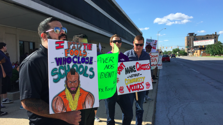 Protestors stand outside Indianapolis Public Schools administration office, on Tuesday, June 27, 2017, to call for more community input on unreleased plan to close multiple high schools in 2018. - Eric Weddle/WFYI Public Media