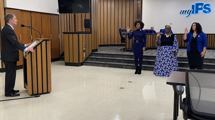 Nicole Carey, Angelia Moore and Hope Hampton were sworn in by Indianapolis Mayor Joe Hogsett as commissioners of the Indianapolis Public Schools Board during a board meeting on Monday, Jan. 9, 2023 at the district office. - Elizabeth Gabriel / WFYI