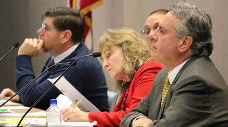 tate Board of Education members Brad Oliver (left), state superintendent Glenda Ritz, and Dr. David Freitas listen to presentations at the January board meeting.  - Rachel Morello/StateImpact Indiana