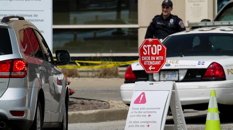 In front of Indiana University Health's Methodist Hospital, signs direct emergency room patients if they are experiencing COVID-19 symptoms. - Lauren Chapman/IPB News