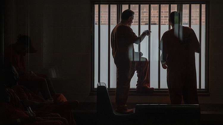 Detainees stand near a window Thursday, June 24, 2021, at the Allen County Jail in downtown Fort Wayne, Ind. - Robert Scheer/ Indy Star