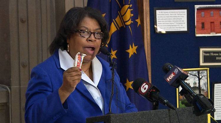 Sen. Jean Breaux (D-Indianapolis) holds up a "Payday" candy bar as she announces details about her bill to address the gender pay gap. - Steve Burns/WTIU
