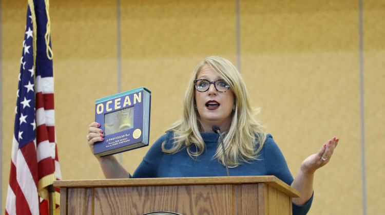 Indiana Secretary of Education Katie Jenner holds up a favorite childhood book at Eastside Elementary School in Anderson, where Lilly Endowment and state officials announced an investment in student literacy. - Eric Weddle/WFYI